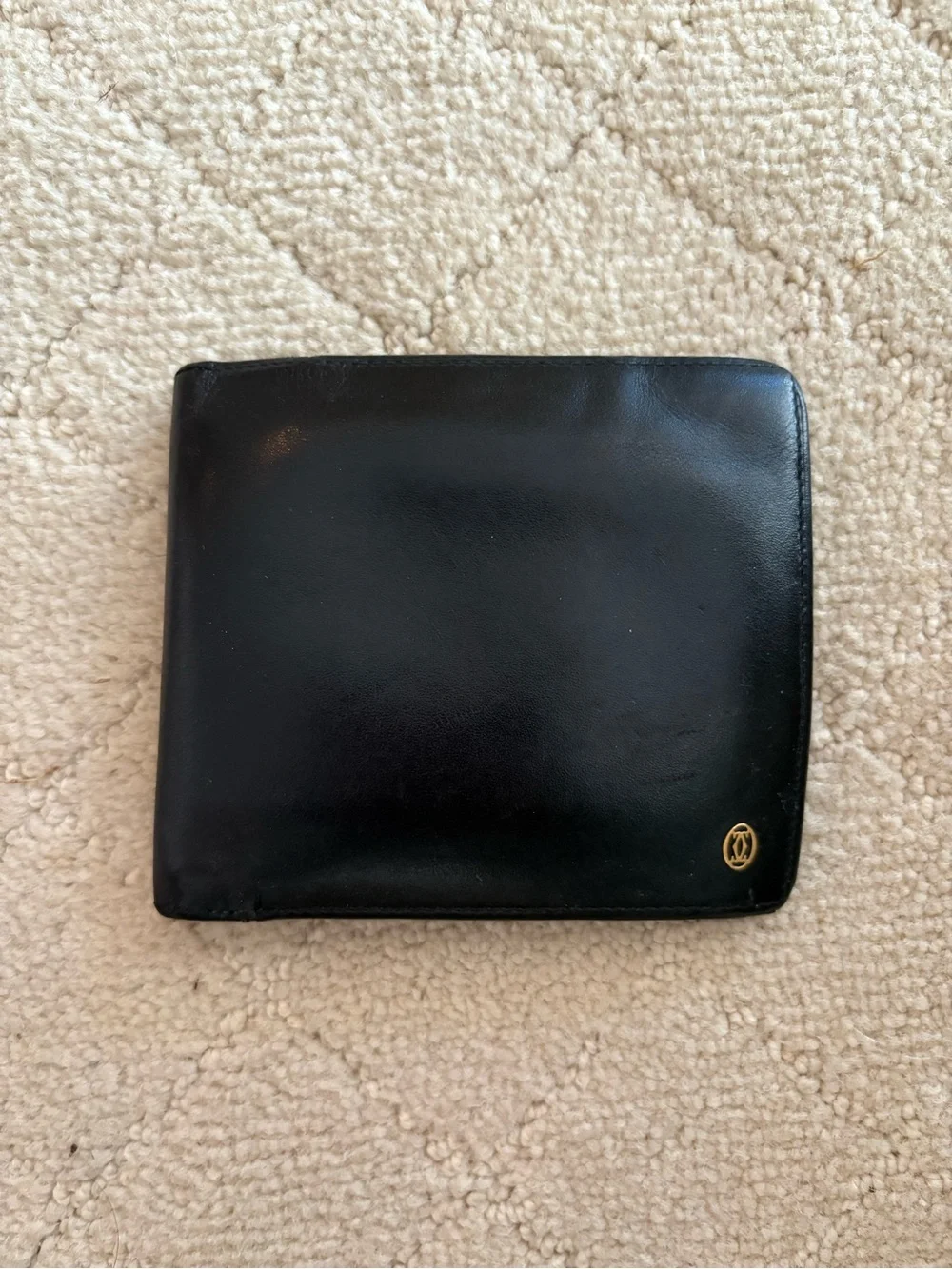 Cartier Black Leather Bi-Fold Card Holder with Gold Emblem